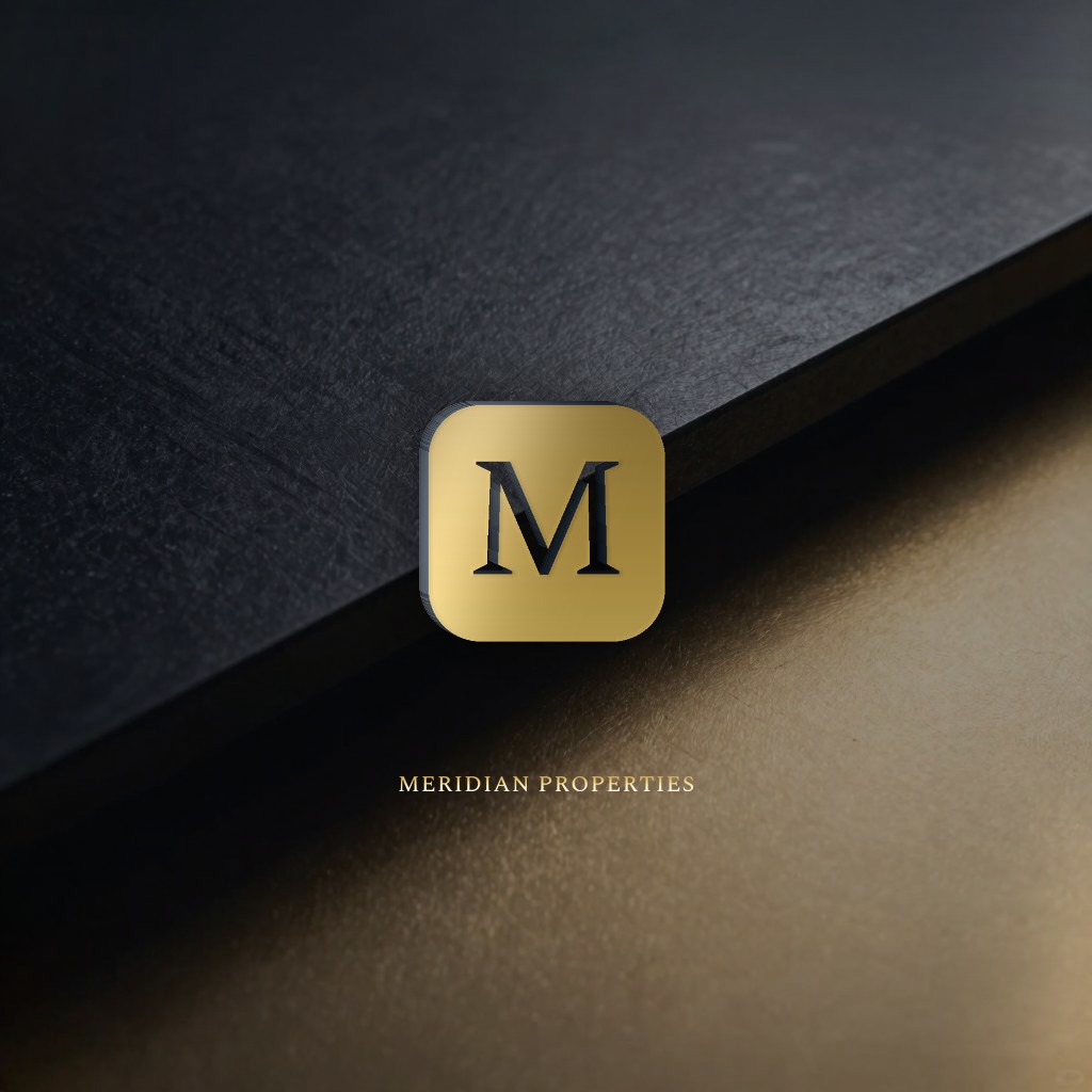 Sample real-estate brand logo in gold-foil on a slate plate